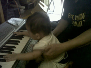 Arreessa playing guitar & keyboard..